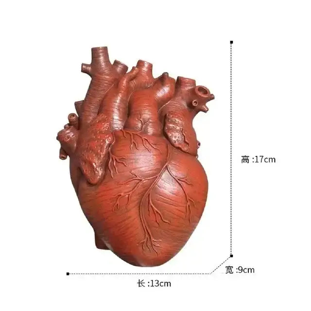 White anatomical heart vase with branches for living room decor